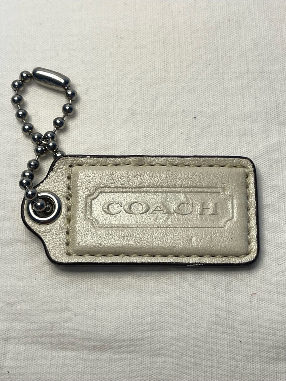 COACH Metallic Cream Leather Hang Tag with Ball Chain
